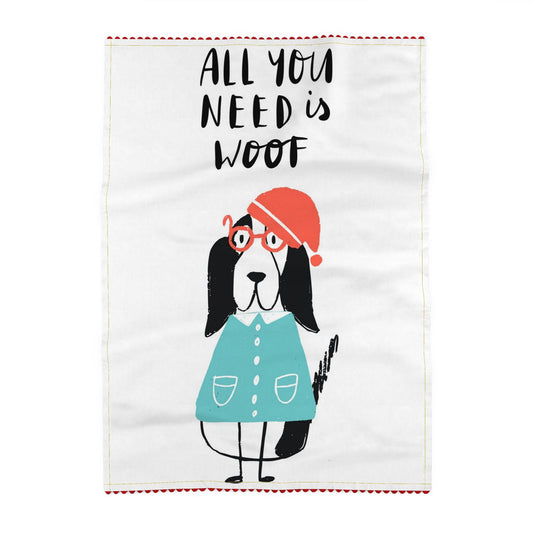 All You Need Is Woof Dog Tea Towel.  Reading All you need is woof, above a dog in a red hat, round red glasses and a teal coat, with long black ears